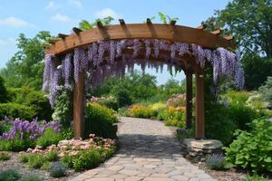 Beautiful wisteria pergola decorating a stone path in a lush garden photo
