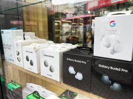 Kyiv, Ukraine - February 04, 2025 Display of various wireless earbud packages arranged on a store shelf photo