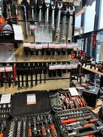 Kyiv, Ukraine - February 04, 2025 Variety of hand tools and wrenches displayed on a store shelf photo