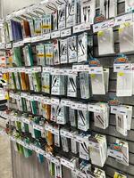 Kyiv, Ukraine - February 04, 2025 Display of USB cables in retail store with various models and prices visible photo