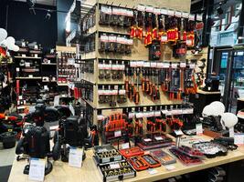 Kyiv, Ukraine - February 04, 2025 Wide selection of tools and equipment displayed in a professional hardware store photo