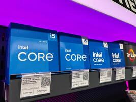Kyiv, Ukraine - February 04, 2025 Shelves Displaying Intel Core Processors with Pricing at Electronics Store photo
