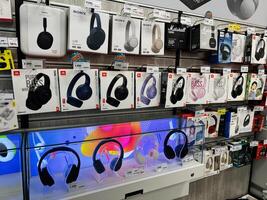 Kyiv, Ukraine - February 04, 2025 Headphone Store Display With Various Models Showcased and Pricing Labels Visible photo