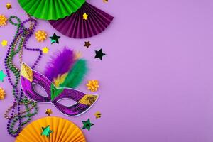 Vibrant Mardi Gras background with mask, beads, and festive decorations photo