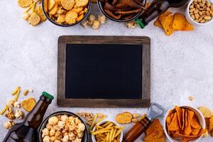 Beer and different snacks for Superbowl or football party photo