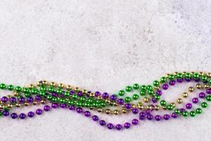 Vibrant Mardi Gras background with mask, beads, and festive decorations photo