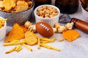 Beer and different snacks for Superbowl or football party photo