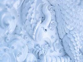 Marble sculpture symbolizing Buddhism in Asia inside a temple Thailand. photo
