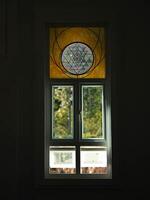 White windows in church with stained glass with various patterns. photo