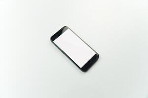Black smartphone on white background with copy space photo