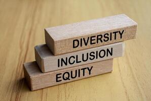 Side view of Diversity, Inclusion and Equity text on wooden blocks. D and I concept photo