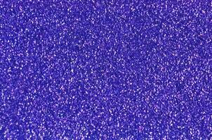 Close up of a dark blue glitter or sparkle texture and can be used as a background or wallpaper for designs. photo