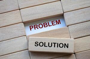 Problem and Solution text on wooden blocks representing problem solving business skill. Solution concept photo