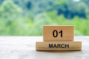 1 March calendar on wooden table with customizable space for text, ideas or messages. Calendar and copy space concept photo