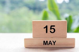 15 May text on wooden blocks with customizable space for text or messages. Month and copy space concept photo