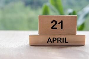 21 April calendar on wooden table with customizable space for text, ideas or messages. Calendar and copy space concep.t photo