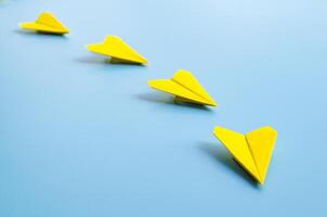 View of origami yellow paper airplane from vision to reality with the flight of leadership photo