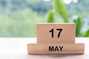 17 May text on wooden blocks with customizable space for text or messages. Month and copy space concept photo