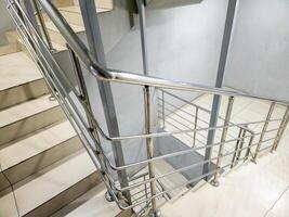 Generic staircases design includes sleek stainless steel railings for aesthetics and safety photo