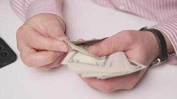 A closeup of hands counting cash, symbolizing essential financial transactions and effective money management video