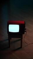 vertical Old analog television showing white static noise in dark room video