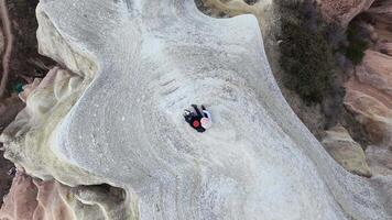 top view couple together sit lay on viewpoint enjoy have fun sightseeing hike in Cappadocia video