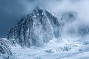 A mountain covered in snow with a dark sky photo