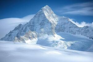 A large mountain with snow on top photo
