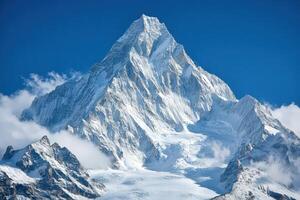 A large mountain with snow on top photo