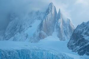 A large mountain with snow on top and ice photo
