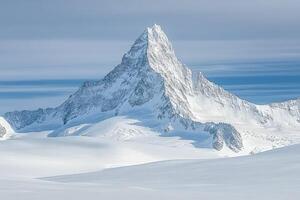 A large mountain with snow on top photo