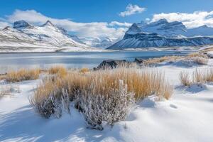 Snow covered mountains and a lake in iceland photo