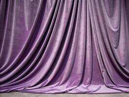 Elegant purple silk drapes with pillow accents in a luxurious setting interior design inspiration soft textiles photo