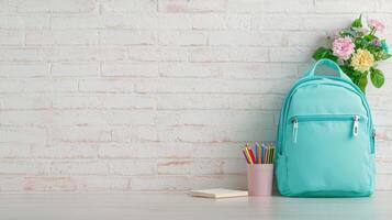 Stylish light blue backpack with colorful pencils on white table against brick wall background, ready for back school Copy space for text, 4K photo