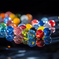 A bunch of colorful marbles on a table photo