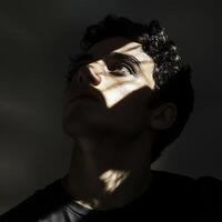 A man is looking up at the sky with his eyes closed photo