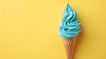 A Sky Blue ice cream cone on a yellow background, summery setting with copy space. photo