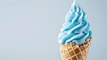 A Sky Blue ice cream cone on a blank white background, summery setting with copy space. photo
