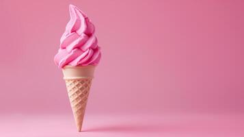 A Pink ice cream cone on a pink background, summery setting with copy space. photo
