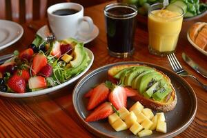 A table with a plate of fruit, a plate of toast, and a cup of coffee photo