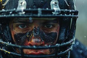 A man with a helmet on in the rain photo