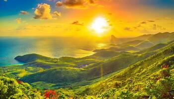 The sun sets over a mountain range with green vegetation photo
