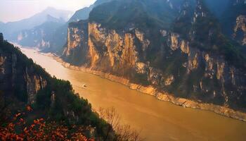 A river flowing through a mountain range with a boat on it photo
