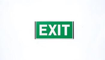 A green exit sign on a white background photo