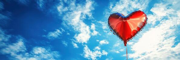 A red heart shaped balloon in the sky photo