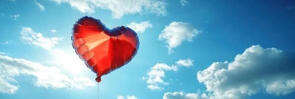 A red heart shaped balloon in the sky photo