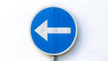 A blue and white sign with an arrow pointing in the direction of the right photo