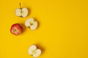 Flat lay composition with Colorful ripe apple fruits on yellow background. Space for text photo
