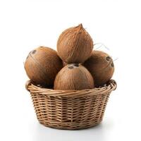 Natural Whole Coconut Placed in Woven Basket photo