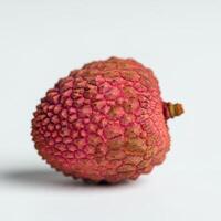 Whole fresh lychee on a white background, showcasing its fresh appearance and texture photo
